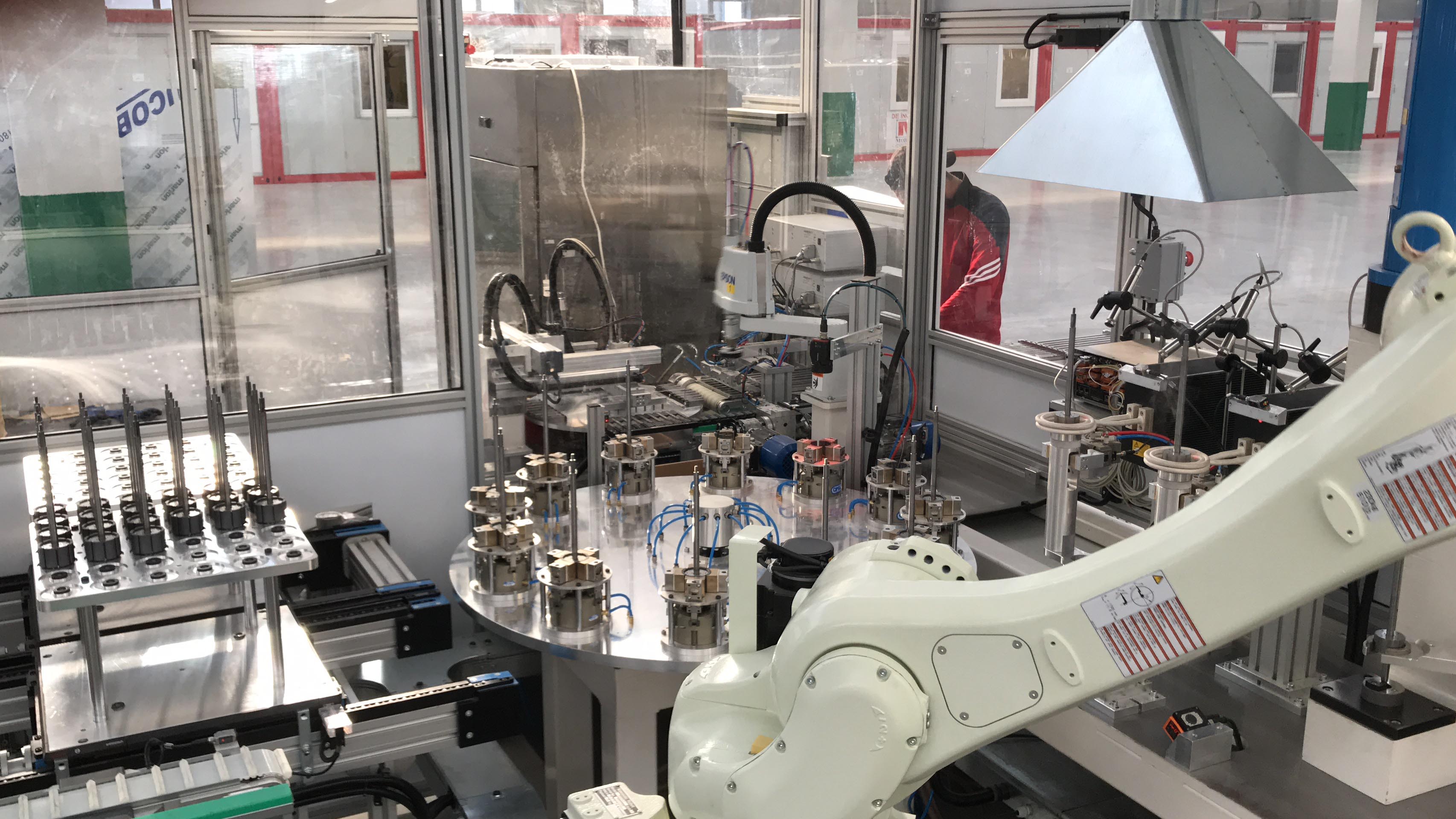 Robotic cell for magnet gluing, shaft-rotor assembly and glue polymerisation control